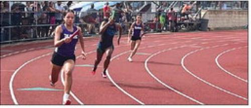 About 150 local kids are participating in the La Grange Optimist Club summer track program. Their first of four meets this month was Saturday in Columbus (above). Photo by Jeff Wick