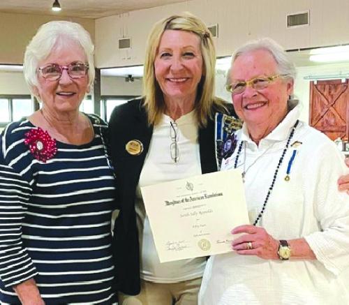 DAR Regent Carolyn Caflisch and Treasurer Jackie Head presented Sally Reynolds with her 50-year award.