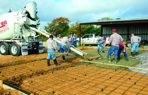 County workers poured a concrete slab last Wednesday for a new recycling center in the Warrenton area. Photo by Andy Behlen