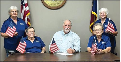 KJZT Proclamation of the flag for Flag Day. Pictured left to right are Lois Kaspar, Mary Jane Toddy, Mayor Stroup, Helen Weid and Rose Rohde (back).