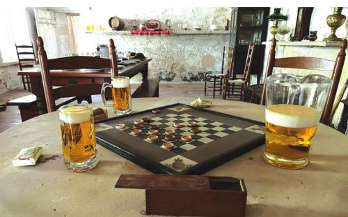 Shown here are parlor games in the Historic Kreische House.