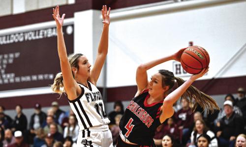 Flatonia’s Braidy Fike puts pressure on Schulenburg’s Brooke Redding in Friday night’s district win over the Lady Shorthorns. Photo by Stephanie Steinhauser