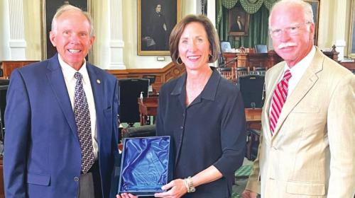 Sen. Lois Kolkhorst accepts the Champion of Transparency Award from Donnis Baggett, right, and Mike Hodges, left, of the Texas Press Association.