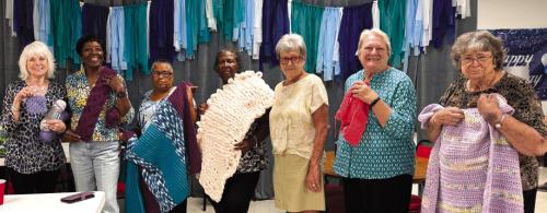 Women in the Artful Friday Crochet class, led by Sheryl Tumis, showed off their art projects at the last class. Pictured from left: Kim Penland, Deborah Jones, Janice Collins, Frida Ellison, Sheryl Tumis, Joan Ulrich, and Leona Lange.