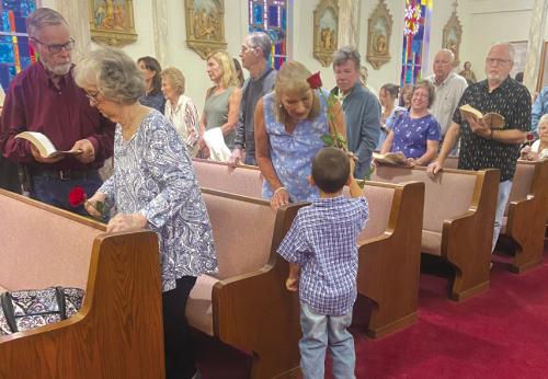 On Sunday, May 19, at Sts. Cyril &amp; Methodius Catholic Church in Cistern, all mothers were called up to the altar for a special blessing. KJZT St. Elizabeth Society No. 20 presented them with roses during the recessional hymn. Pictured is William Vinklarek with Laura Grudziecki. His mother, Tamara, and sister Lilly assisted.