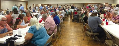 Visitors enjoying the BBQ meal at Fayetteville St. John Feast.