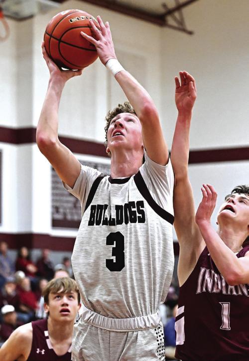 Camden Bosl goes up for two Tuesday night as district play wraps up and the Flatonia Bulldogs head to the playoffs.
