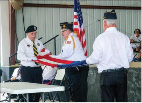 From left: Andy Janda of Vietnam Veterans of America Chapter 870, Scott Jones of the La Grange American Legion Post 102 and Bernard Svatek of Flatonia American Legion Post 94 conducted the flag folding ceremony at the Fayette County Flag Day Celebration on Sunday, June 14. Photo by Andy Behlen