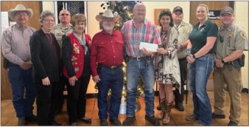 Hostyn KJT Society No. 3 presented a donation to the Fayette County Deputy Santa Program. This program enables underprivileged children across the county experience the true meaning of Christmas. Pictured in the presentation were from left: Chief Deputy Randy Noviskie, KJT Secretary Joyce Muras, Deputy Joe Gonzales, KJT Reporter Dianna Kallus, KJT Vice President Benedict Kallus, Lt. David Beyer, KJT Treasurer Brenda Fietsam, Deputy Lee Phillips, Sergeant Detective Angela Lala, and Deputy Rick Bohlmann.