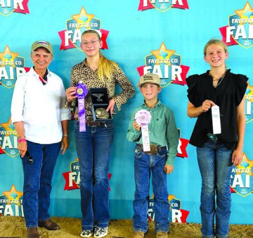 Overall High Point Winners, Junior, buckle sponsor in Memory of Emil Thomas, Elaine Thomas; Kennedy Kaspar, Rowdy Guenther and Harper Pittman.