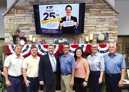 National Bank &amp; Trust, celebrating 138 years of community banking in La Grange, recently honored Michael Corker for 25 years of service on its Board of Directors. Board members and employees surprised Corker during the July board meeting to recognize his steadfast leadership and the lasting impact he has made on the bank, its employees, and the communities it serves.