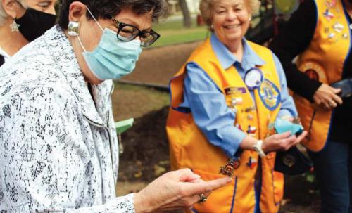 La Grange mayor Janet Moerbe waits for her butterfly to take flight during Saturday’s ceremony. Photos by Jeff Wick