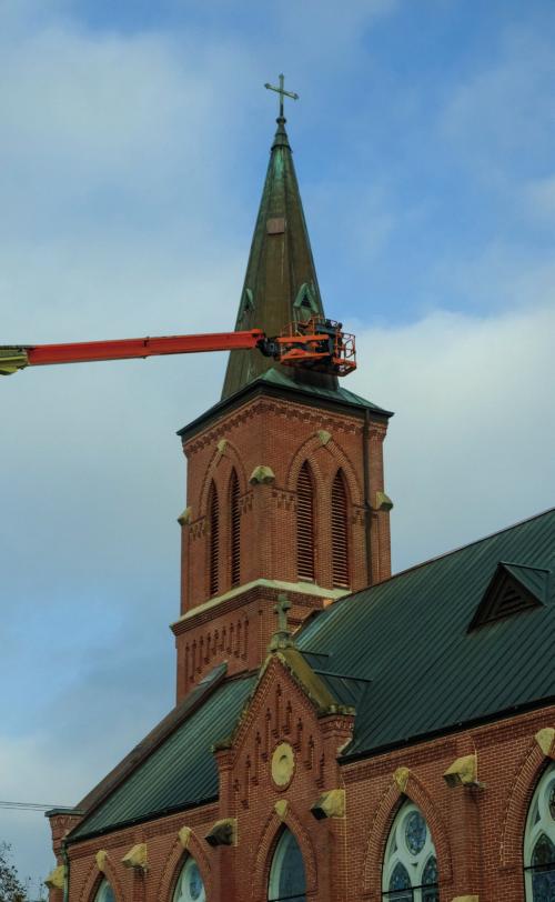Workers with Texas Built Roofing of Waco performed repairs on the roof of St. Mary’s Catholic Church in High Hill. Notice the new copper louvers that have been installed in the bell tower. Workers also replaced the church’s ridge cap and several gutters. Photo by Andy Behlen