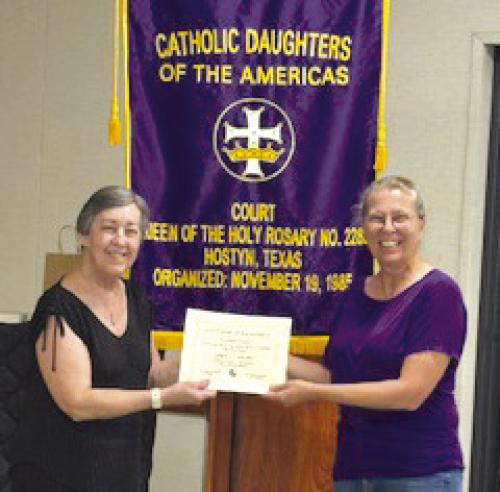 CDA Court Queen of the Holy Rosary received two awards at the State Level at the Convention held in Dallas April 23-27. The Court won a first place award in the State Circle of Love Contest in Category IV Education. Accepting the award is Shirley Macik, Local Education Chair, and Sarah Koehl (Regent).