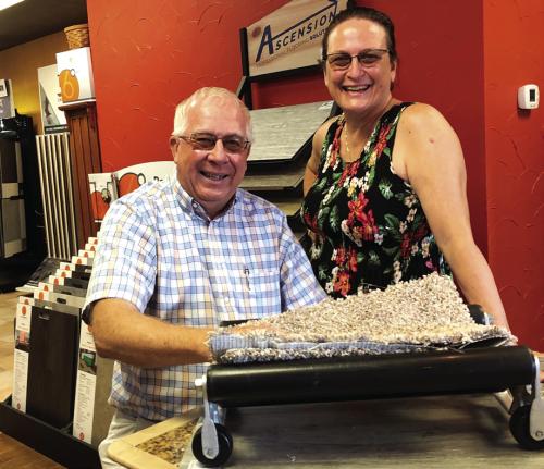 Gary and Gale Lincke, who own and operate Lincke Floors Inc. in La Grange, are shown here celebrating the family-owned business’s 70th anniversary in June 2021. This Tuesday the Linckes will celebrate the 75th anniversary of the business. The next day they are closing for good. Record file photo by Elaine Thomas