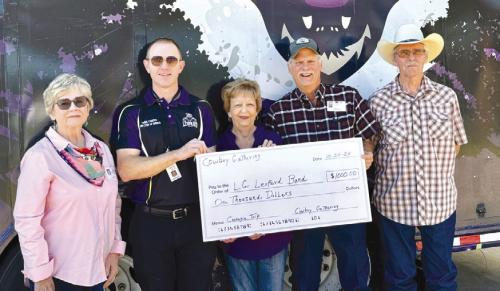 The Best Little Cowboy Gathering in Texas recently made a donation of $1,000 towards the LHS Mighty Leopard Band for their upcoming trip to Carnegie Hall. Pictured are Gloria Heinrich, Chris Cooper, La Grange High School Band Director, Barbara Kalina, Jon Quinn, and Bobby Gronewald.