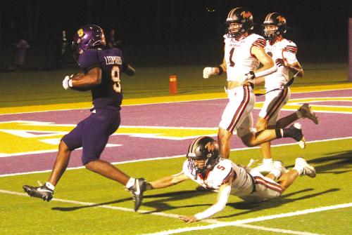 Above: La Grange’s Dillan Johnson trots into the endzone for one of his three first half rushing touchdowns Friday.