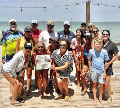 The Fayette County Record was on hand last weekend on the Matagorda Peninsula just off the coast of Port O’Connor, for the birthday celebration of former La Grange resident, Deb Fajkus Powell. Here she is holding the Record with a few of her family and friends that attended her birthday celebration.
