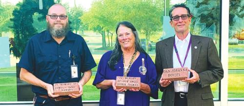 Holding one of the new memorial pavers is Mel Burgess, SMMC Facility Director; Mary Kahanek, SMMC Volunteer Coordinator; and Michael Corker, SMMC Foundation President and Board of Directors Vice Chairman.