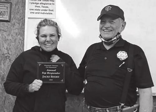 Jacki Short, left, receiving her “Responder of the Years” award from the Winchester Area VFD.