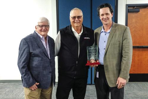 Region 13 Chairman Gary Barnett (left) and executive director Rich Elsasser (right) presented Erwin Sladek (center) with a plaque during the dedication last Thursday. Photo by Andy Behlen