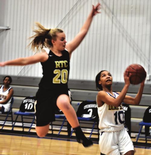Round Top-Carmine’s Kim Rohde leaps to try to block this shot by a Dime Box player in Tuesday’s game. Photo by Paul Kipp