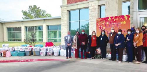 Pictured are Mark Kimball, president and CEO of St. Mark’s Medical Center and staff at St. Mark’s who helped coordinate the annual Thanksgiving food basket drive.