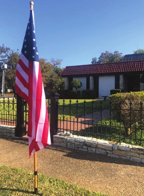 KJT Insurance offices place six flags in honor of Veterans Day supporting the La Grange Noon Lions Club subscription flag program.