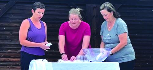 Some of the stars of the new play, from left: Staci Ulrich, Heather Barthelme and Ann Raborn during rehearsal. Photo by Tara Lowe