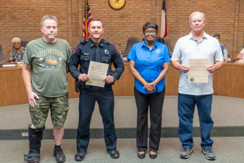 Monday night, the City of La Grange and Fayette County EMS presented life saving awards to La Grange Police Officer Mitchell Maxwell and citizen Michael Pechal, the two men who saved the life of La Grange Police Officer Kevin Currington last month. Pictured above (from left) are Currington, Maxwell, La Grange Mayor Jan Dockery and Pechal. Photo by Andy Behlen
