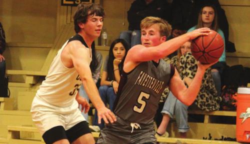 Fayetteville’s Logan Fritsch looks for an open pass against the defense of RT-C’s Hunter Schobel. Photo by Jeff Wick