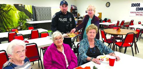 Schulenburg Police Officer Chris Kalina receives a platter of cookies from some of our members at Senior Connections. Pictured Clara Christ, Cynthia Myer, Judy Klesel, and Aileen Kasper were present on this day.