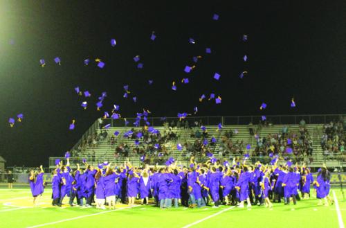 The seniors throw their graduation caps into the sky at the conclusion of Thursday’s ceremony. Photo by Jeff Wick