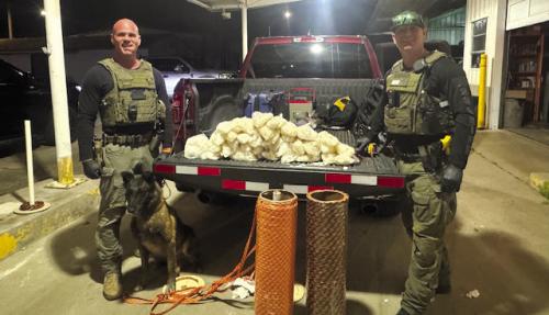 Sgt. Randy Thumann, K9 Kolt, and Investigator David Smith.