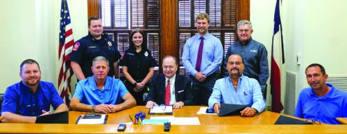 Photo ID: (back, from left) Fayette County EMS Director Josh Vandever, paramedic student Rebecca Spooner, Kyle Hartmann of La Grange Rotary Club and CVTC General Manager Kelly Allison. Front row: Fayette County Commissioners Court, Drew Brossmann, Harvey Berckenhoff, Judge Dan Mueller, Luke Sternadel, Jason McBroom. Photo by Andy Behlen