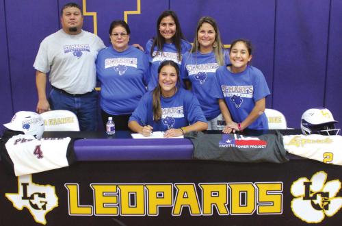 La Grange senior softball star Abigail DelaRosa held her signing ceremony Thursday to celebrate officially accepting a scholarship offer to play college ball for St. Mary’s University in San Antonio. Shown here is Abigail, front and center. Back row, left to right, are her father Lorenzo, grandmother Mary, sister Alyssa, mother Myra and sister Anabella.