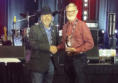 Texas Association of Fairs and Events (TAFE) presented Fayette County Fair Association President Michael Zuhn with its Volunteer of the Year Award. Zuhn is pictured above, right, receiving the award at the TAFE Convention in Fort Worth, which took place Jan. 9-11.