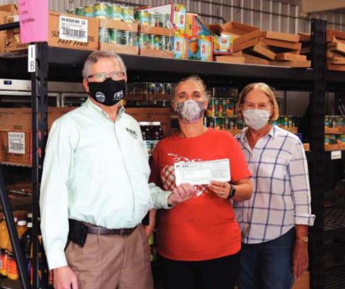 Local Co-ops Donate to AMEN & Hospice Brazos Valley