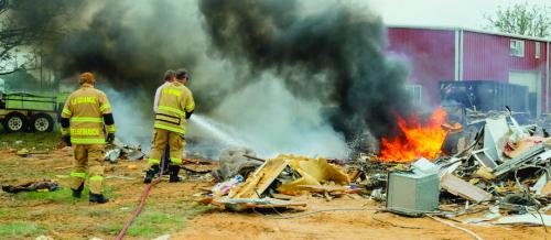 La Grange firefighters extinguished a fire that got out of control on Trinity School Rd. Thursday afternoon. Photo by Andy Behlen