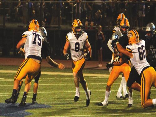 La Grange linemen Hayden Splawn, left, and Jayden Pearson, right, open up a hole for Lep Ryder Imhoff to run through in Friday’s game at La Vernia. Photo by Jeff Wick