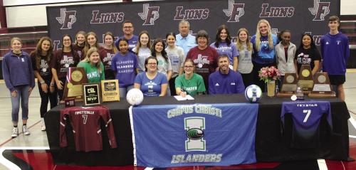 Fayetteville volleyball star Brooklyn Jaeger, who led the lady Lions to last year’s 1A state volleyball title, officially signed a scholarship agreement to play for Texas A&amp;M Corpus-Christi Wednesday. During her signing ceremony she wanted her teammates to pose with her as she signed. Seated beside Brooklyn are her parents Clint and Jennifer Jaeger. Also standing with the team are her brother Easton and grandparents Edward and Nancy Gaertner. Photo by Jeff Wick