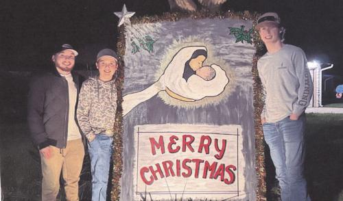 On the corner of S. Washington and W. Pecan Street in La Grange is a giant Christmas card which sends the message as a reminder of the true meaning of Christmas. It is located at the home of Jim and Norma Bowman; she was the artist who created this painting. This photo shows three wisemen who came from Beaumont to share the message. They are three of the Bowmans’ thirteen grandchildren. From left to right: Ashton, Colby, and Tyler.