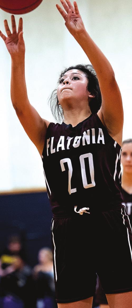 Elzah Herrera shoots for two for the Flatonia Lady Bulldogs Tuesday night in Weimar. Photo by Stephanie Steinhauser