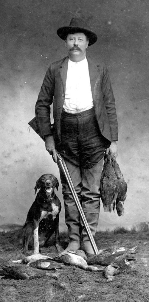 Louis Melcher in hunting gear at El Campo in 1902 with his dog, courtesy of the Fayette Heritage Museum and Archives.