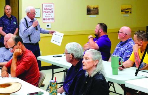 Dr. Mike Mabry questions La Grange ISD board members Anthony Wessels and Gary Drab about whether the bond will lead to improved educational outcomes at La Grange ISD. Photo by Andy Behlen