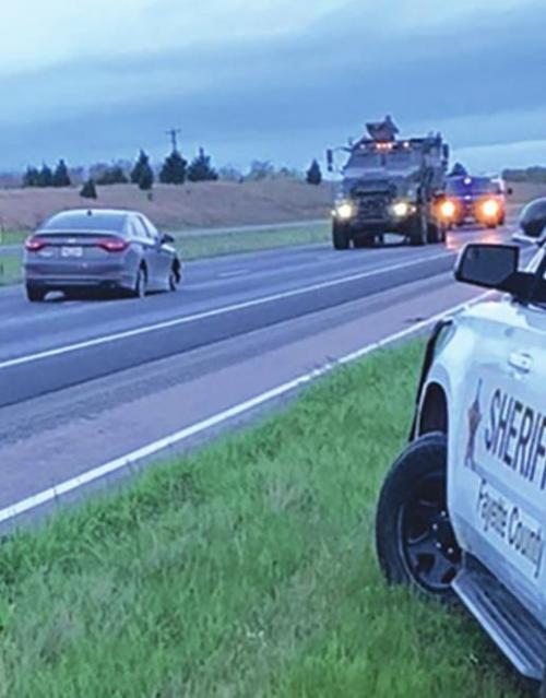 Law enforcement vehicles surrounded the car, upper left, that led officers on a pursuit over five counties.