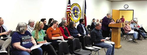 Book Scrutiny Draws a  Crowd to Board Meeting