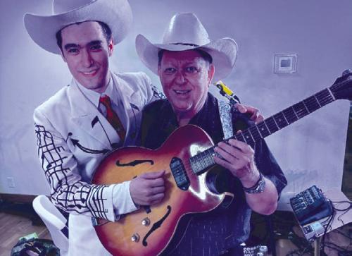 Wyatt Aleman is pictured here with local musician Mark Lehmann following the recent Hank Williams Tribute Show at the Fayette County Country Music Opry. They’re holding a periodcorrect electric guitar provided by the wife of the late Austin swing/country guitar singer “Boomer” Norman. Photo courtesy of John Dujka