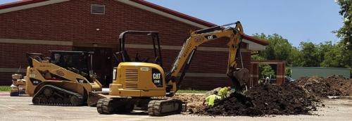 At La Grange High School sewer line replacement is progressing. Here’s how it looked Tuesday. They are trying to get the parking lot portion completed before school starts. Photo by Meadow Taylor-Marklin