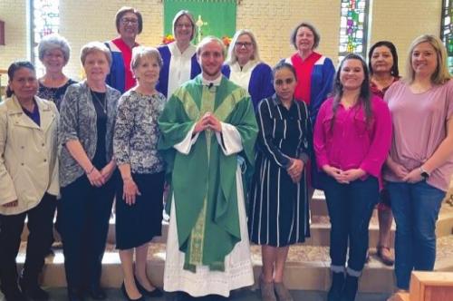 Celebrating National CDA Day was front from left: Jacinta Cano, Marian Tajchman, Beverly Kruppa, Fr. Brian Phillips, Guadalupe Mendez, Mical Ann Boyd, Candice Hall; back row: Stacy Ryza, Mary Lou Anderle-State Spiritual Enhancement Chair and Local Recording Secretary, Shirley Antosh Regent, Carolyn Weishuhn-Vice Regent, Marilyn Kothmann-Financial Secretary, and Beatrice Ortiz.